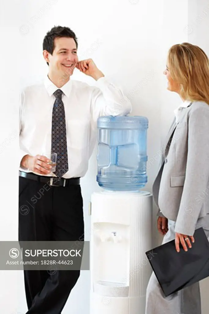 Business People Talking at the Water Cooler   