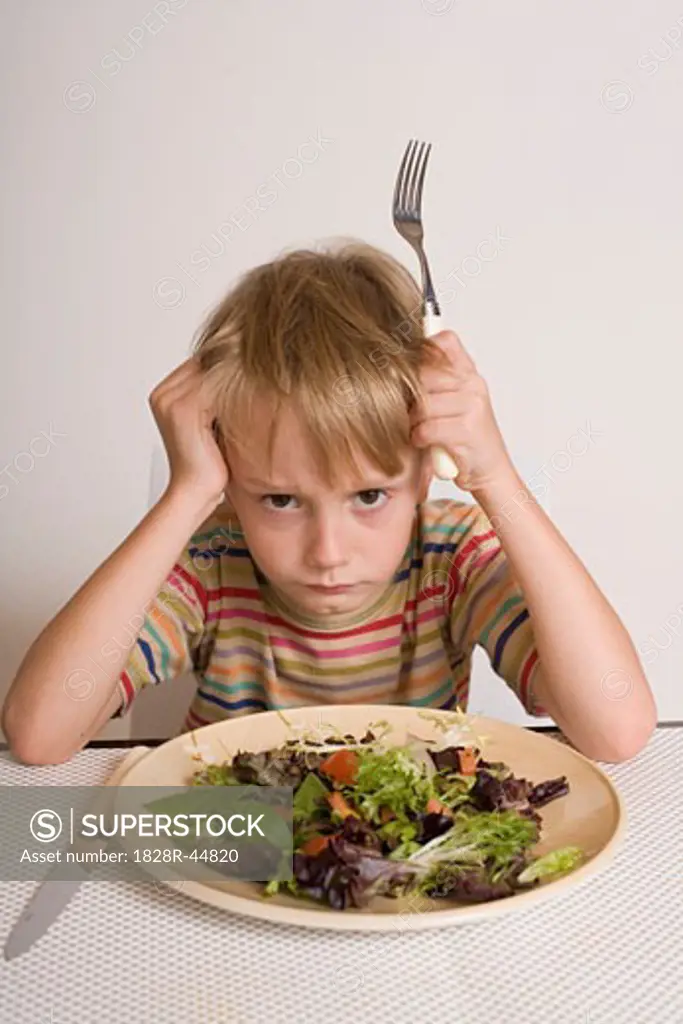 Boy Refusing to Eat Salad   