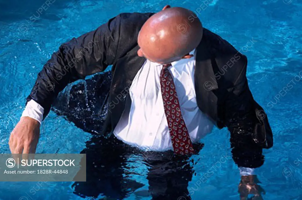 Businessman in Swimming Pool   