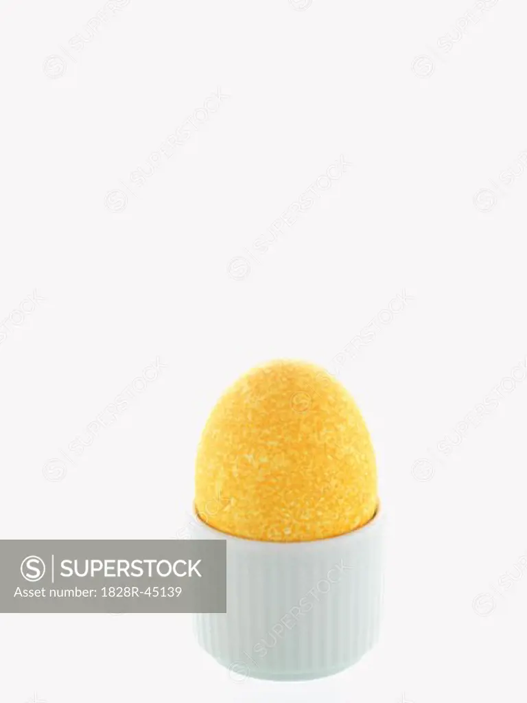 Yellow Easter Egg in White Eggcup   