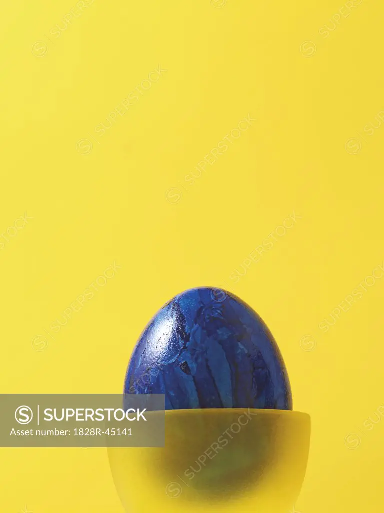 Blue Easter Egg in Yellow Eggcup   