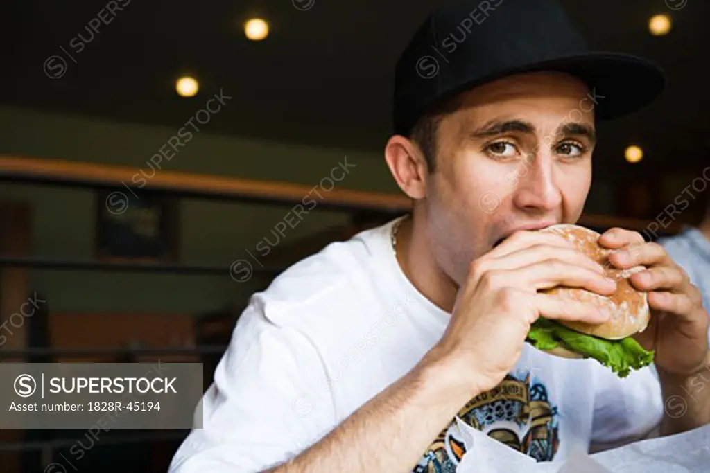 Man Eating Hamburger   