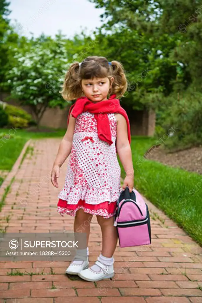 Little Girl Carrying Lunch Bag   
