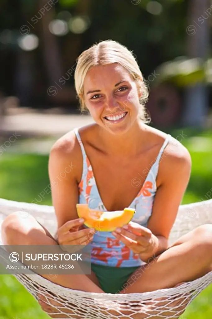 Woman Eating Cantaloupe   