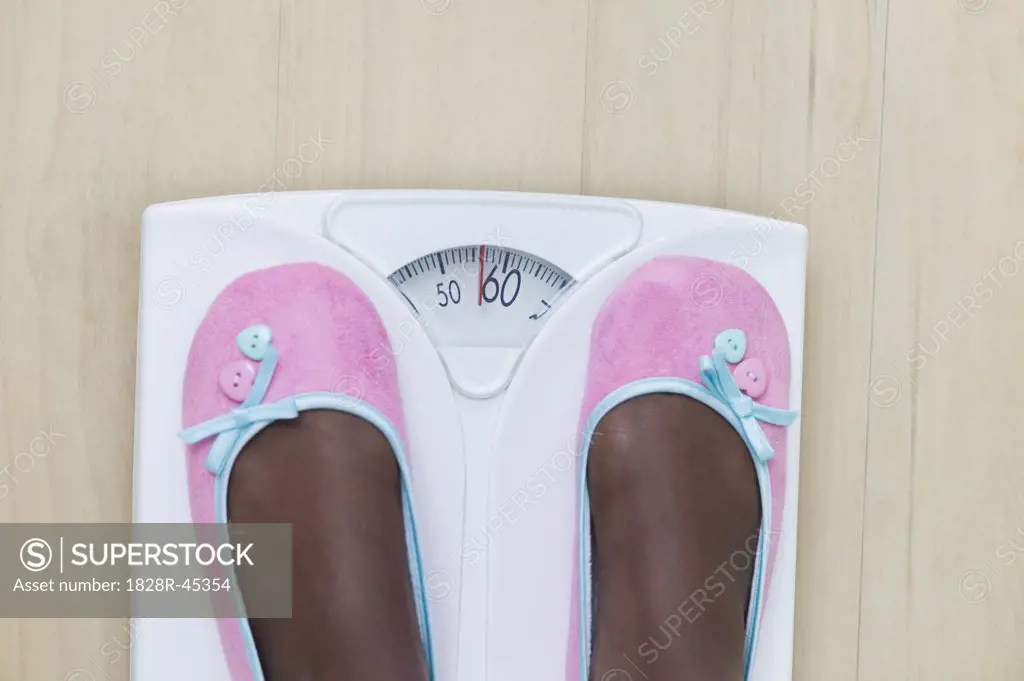 Woman's Feet on Bathroom Scale   