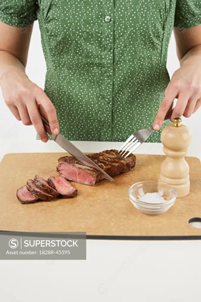 Woman Eating Steak   