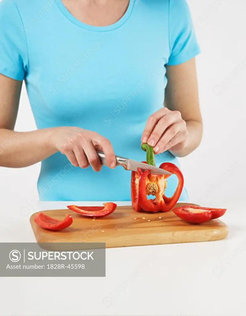Woman Slicing Red Pepper   