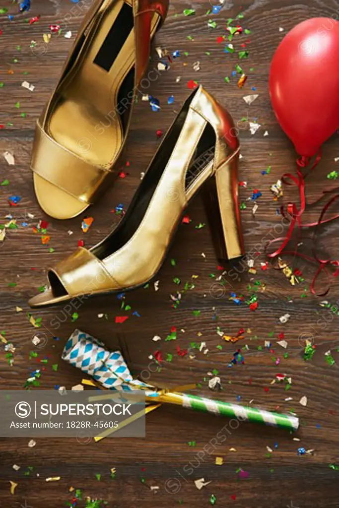 Close-up of Shoes, Noisemaker, Balloon and Confetti   