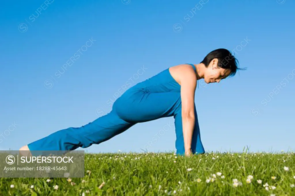 Woman Practicing Yoga   
