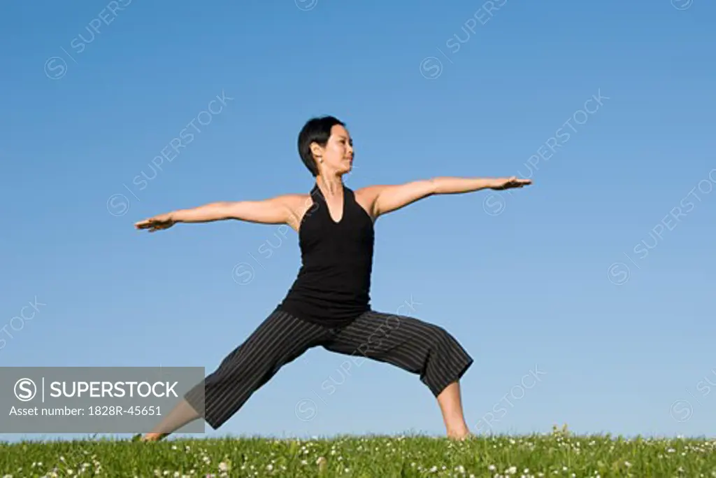 Woman Practicing Yoga   