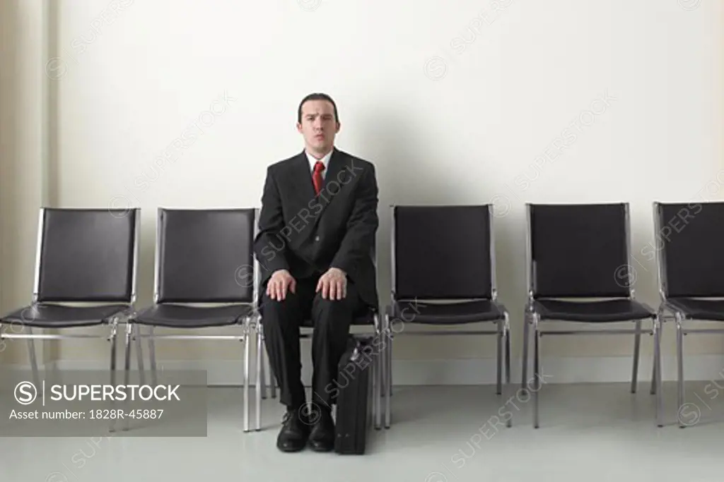 Businessman in Waiting Area   