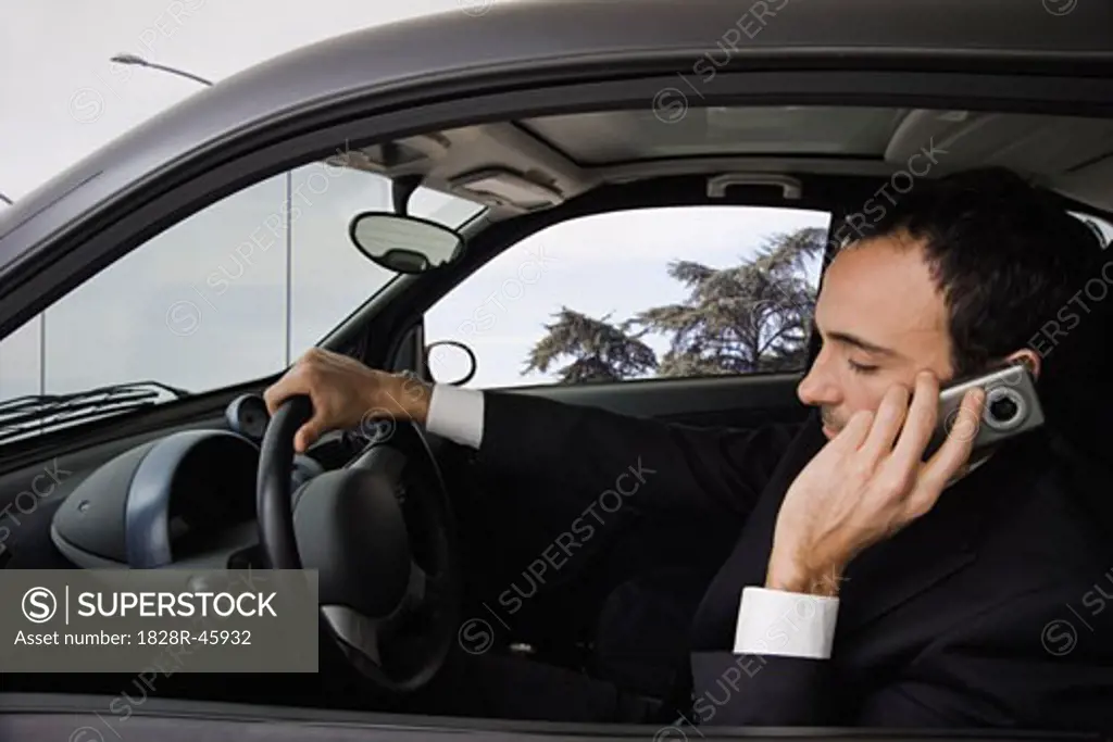 Man Driving and Using Cell Phone   