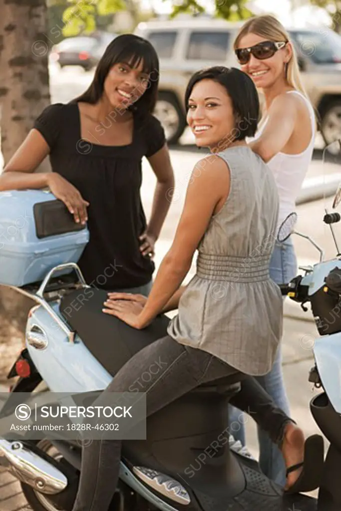 Women at Side of Street with Scooter   