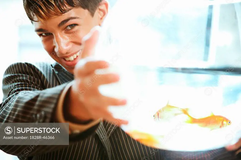 Portrait of Man Holding Goldfish Bowl   