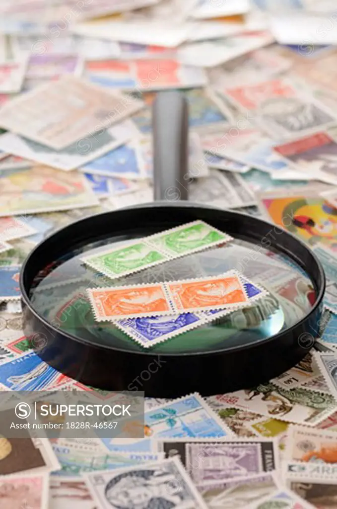 Magnifying Glass and Stamp Collection   