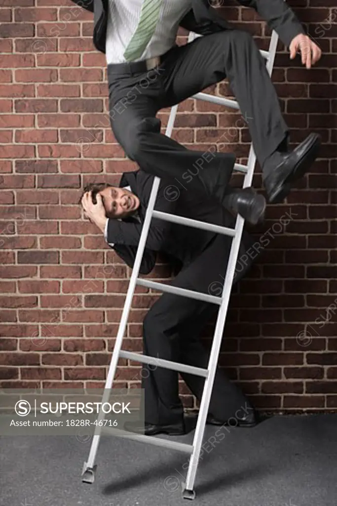 Businessman Jumping off Ladder   