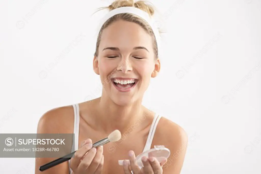 Young Woman Applying Make-Up   