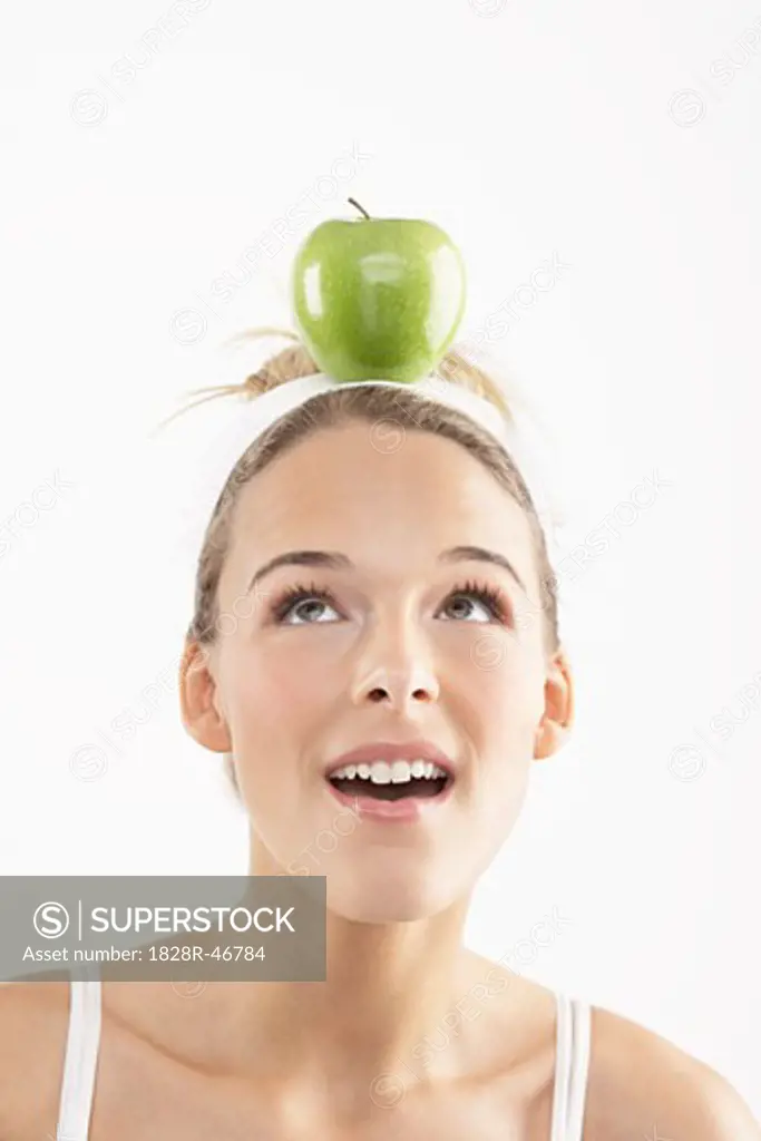 Portrait of Young Woman with Apple on her Head   