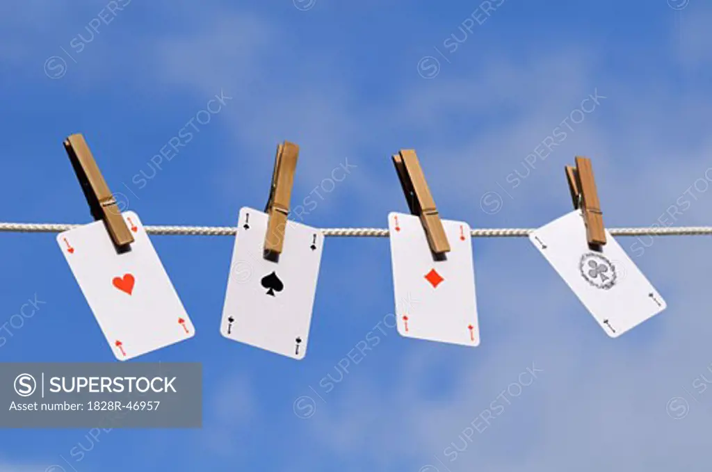 Playing Cards Pinned to Clothesline   