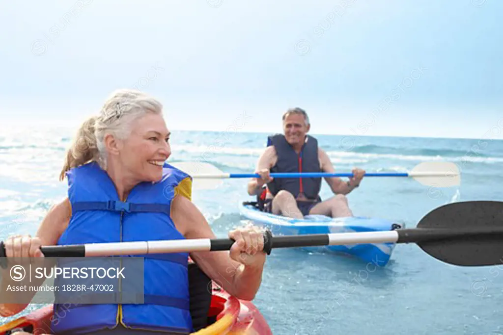 Woman and Man Kayaking   