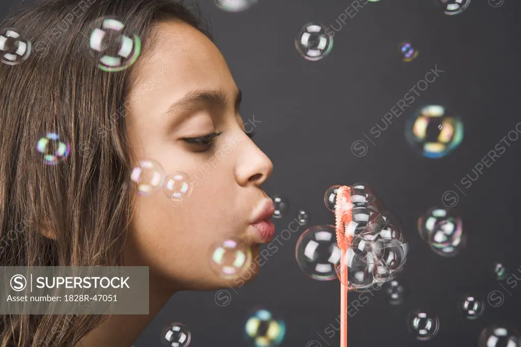 Girl Blowing Bubbles   