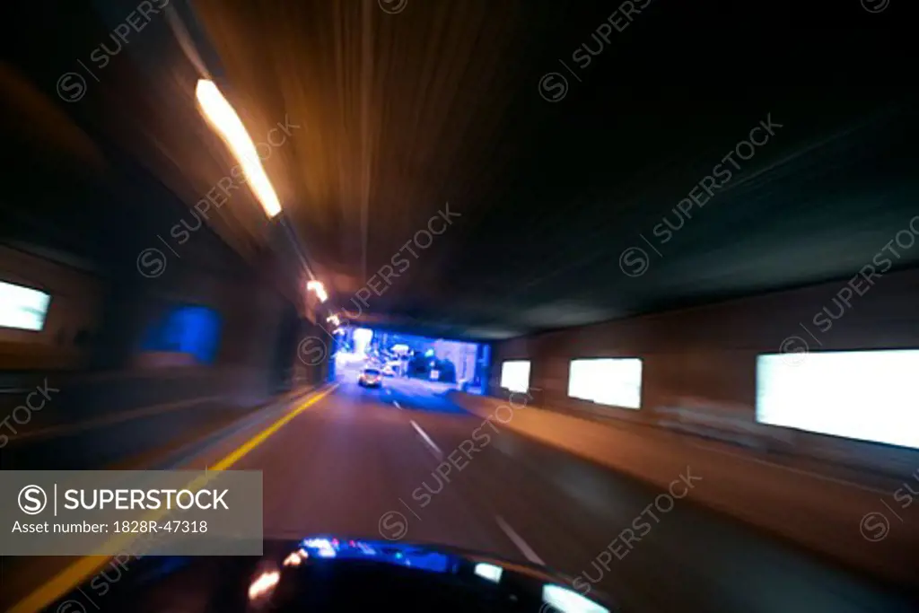 Car Speeding Through a Tunnel Toronto, Ontario, Canada   
