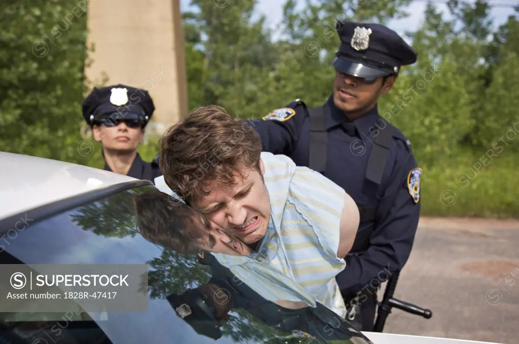 Police Officers Arresting Suspect   