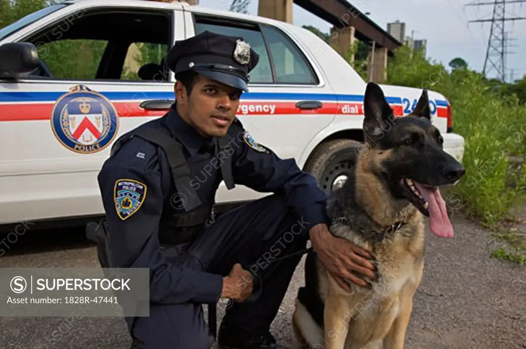 Portrait of Police Officer With Police Dog   