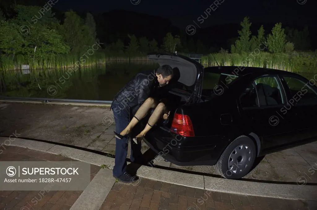 Man Disposing of Woman's Body   