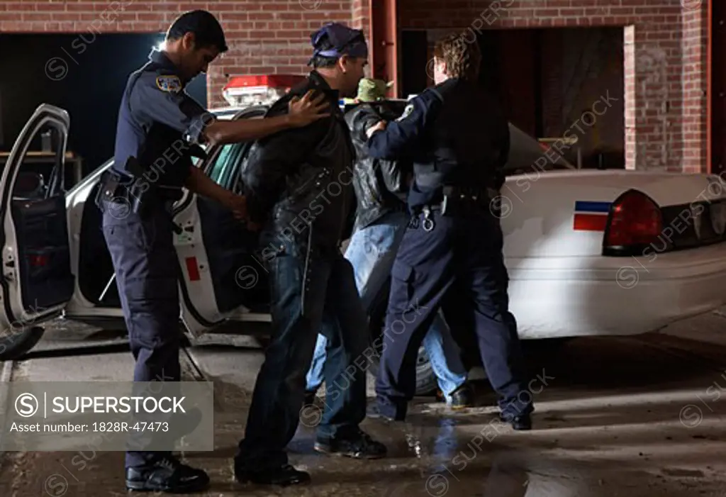 Police Officers Arresting Suspects   