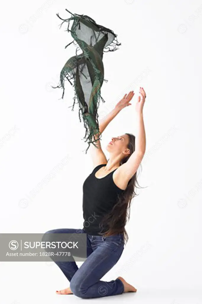 Woman Tossing Shawl in Air while Dancing   
