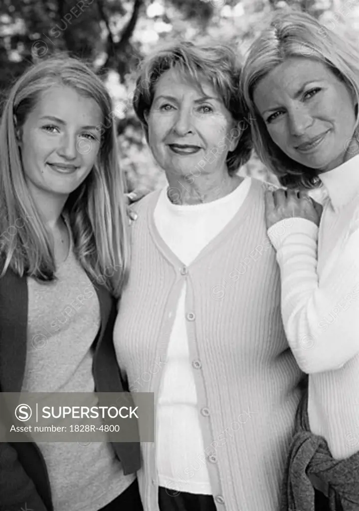 Portrait of Grandmother, Mother And Daughter Standing Outdoors   