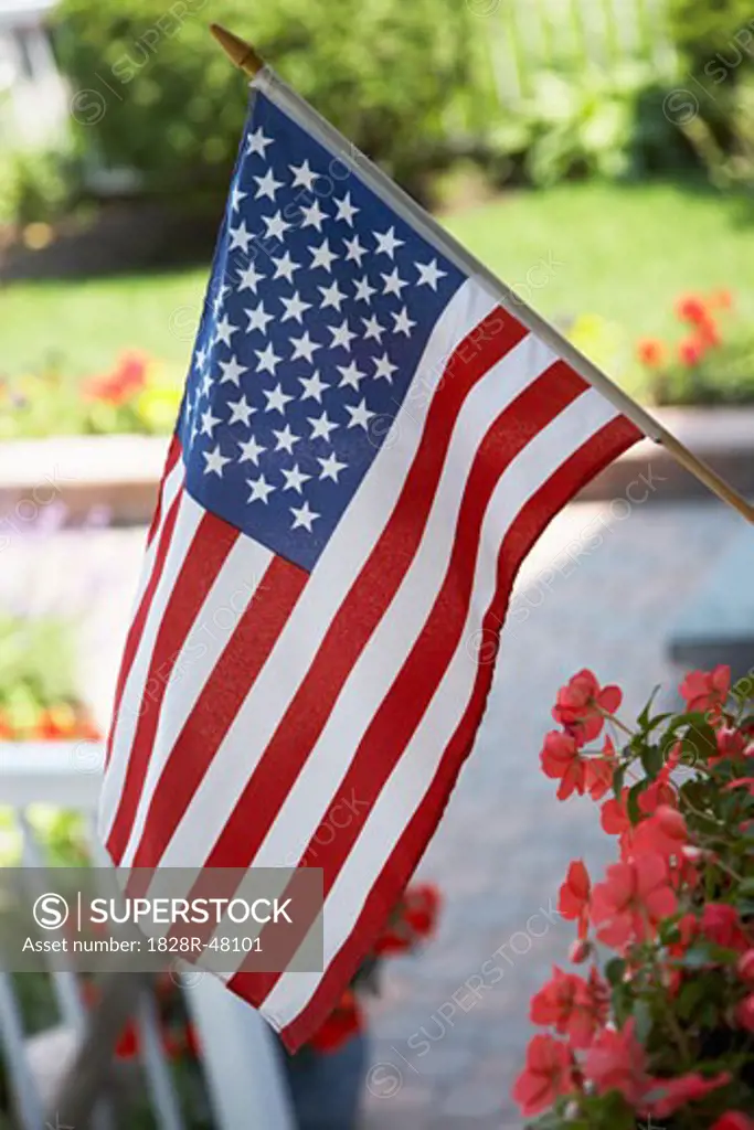 American Flag Flying From Porch   