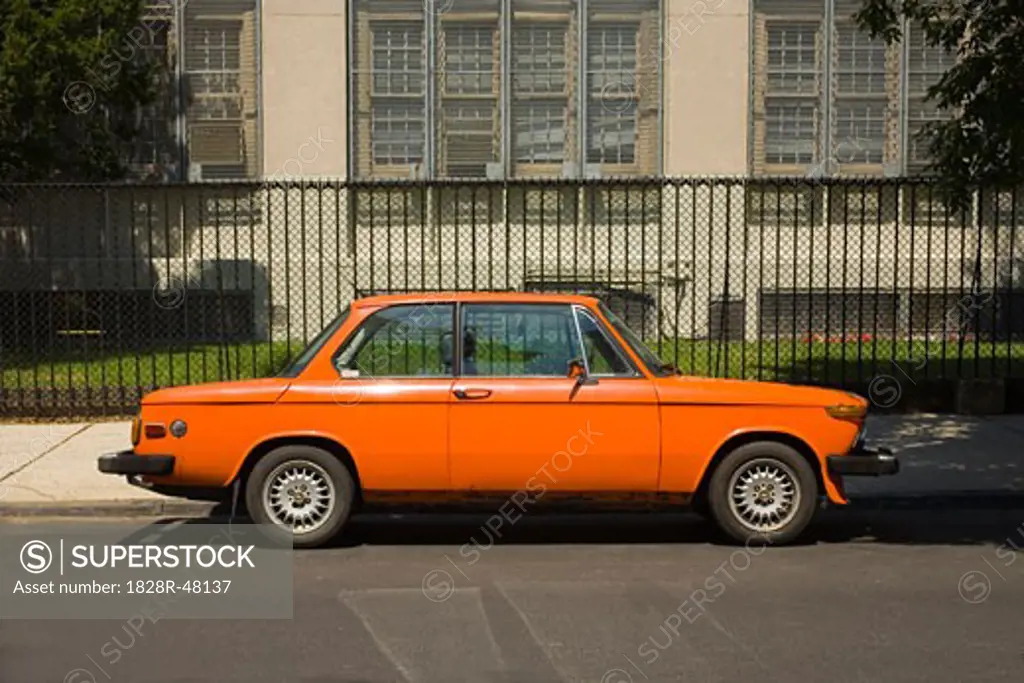 Orange Car at Side of Road   