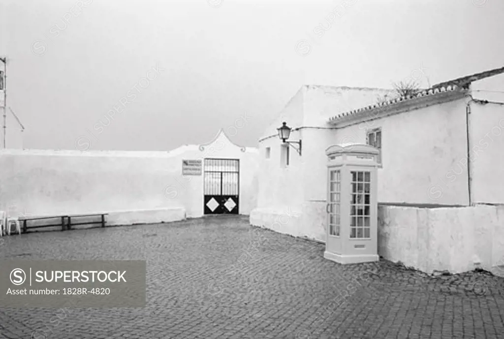 Telephone Booth near Wall with Gate, Portugal   