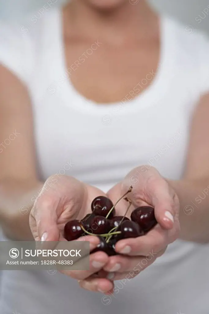 Woman Holding Cherries