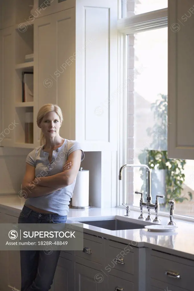 Woman Leaning on Kitchen Counter,   