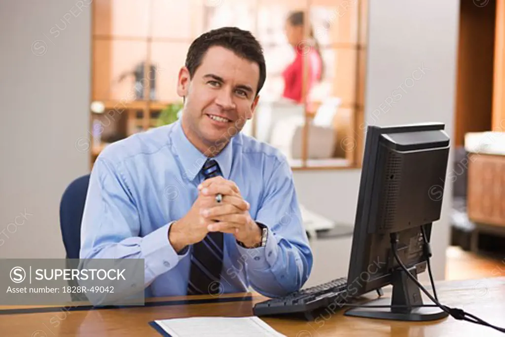 Portrait of Businessman at His Desk   