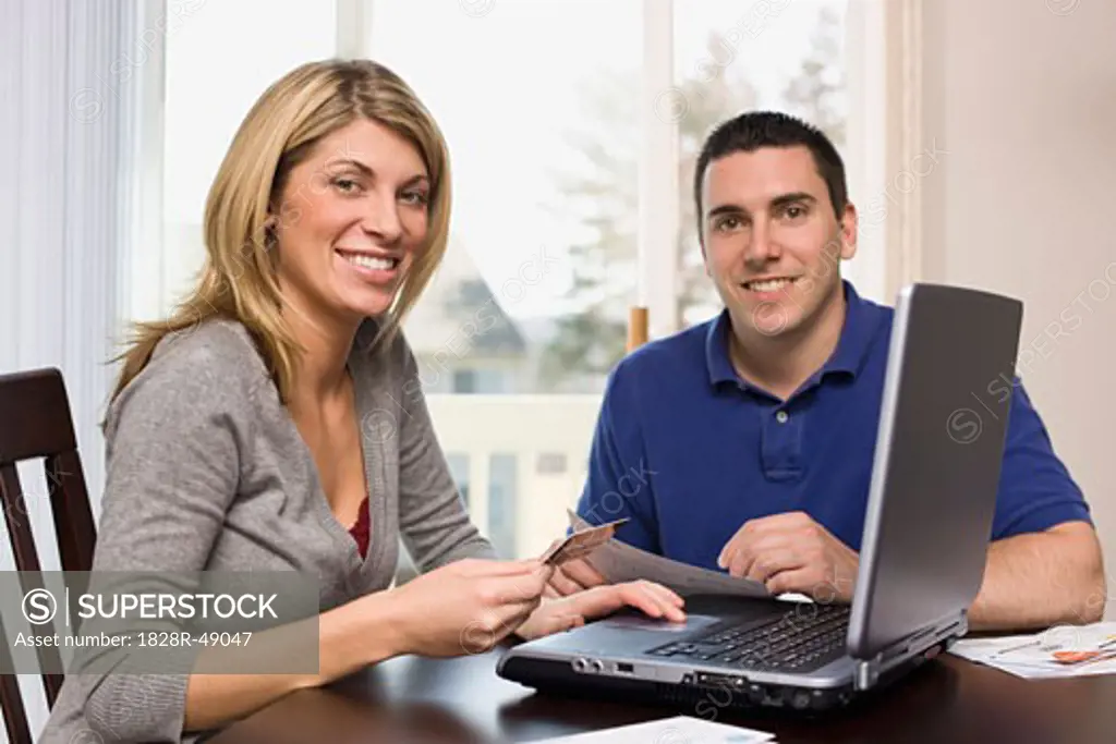 Couple Paying Bills Online   