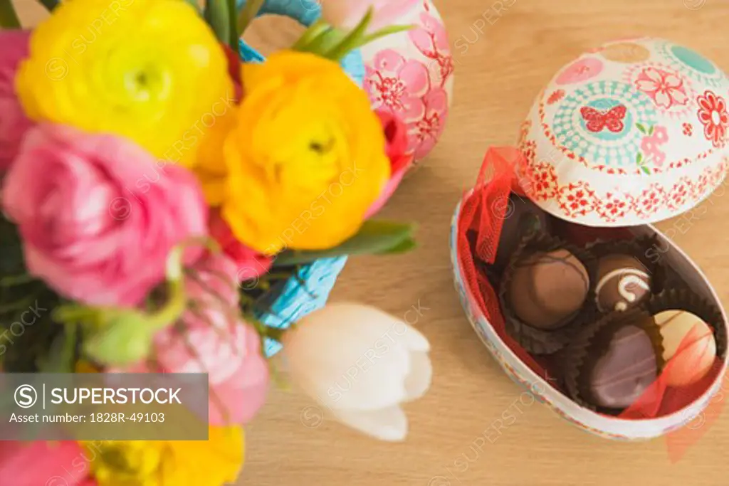 Easter Egg Filled With Chocolates, and Vase of Flowers   