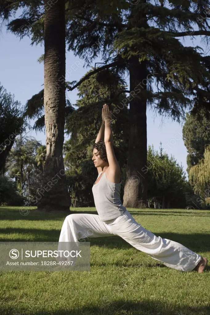 Woman in Doing Yoga in Park, Rome, Italy   