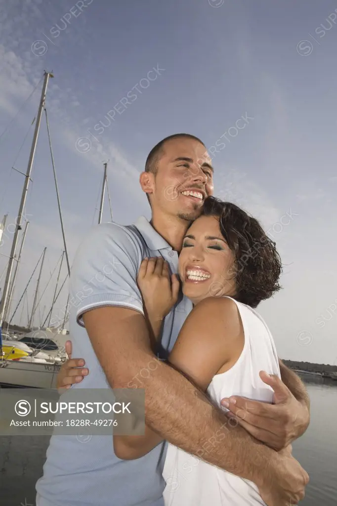 Couple Hugging by Harbor, Rome, Italy   