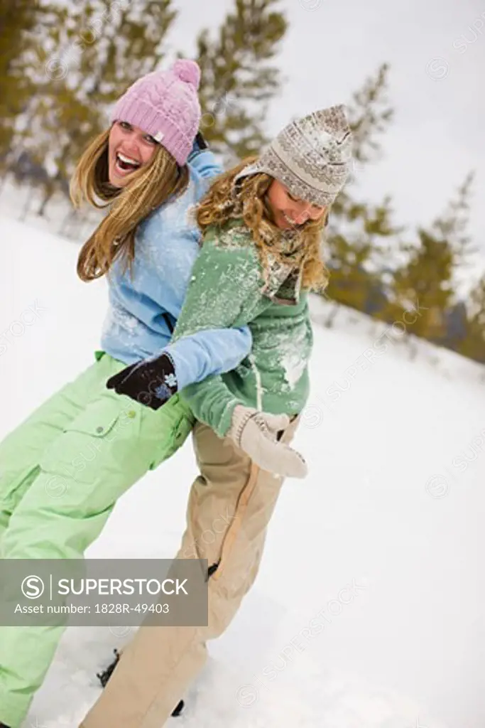 Two Women Playing in the Snow, Near Frisco, Summit County, Colorado, USA   