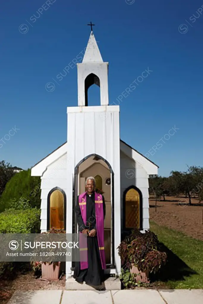 Priest Standing in Front of Church, Niagara Falls, Ontario, Canada   