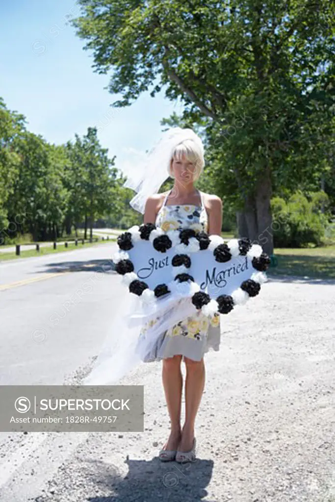 Woman Holding Just Married Sign by Side of Road, Niagara Falls, Canada   