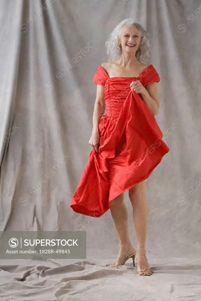 Portrait of Mature Woman Wearing Red Dress   