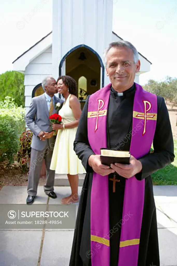 Priest by Chapel with Newlywed Couple, Niagara Falls, Ontario, Canada   