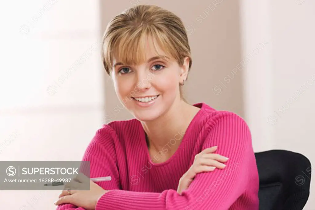 Portrait of Woman Holding Pen   