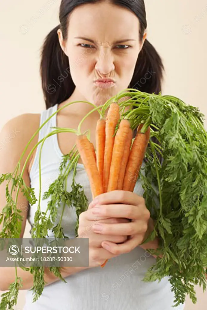 Woman Holding Carrots   