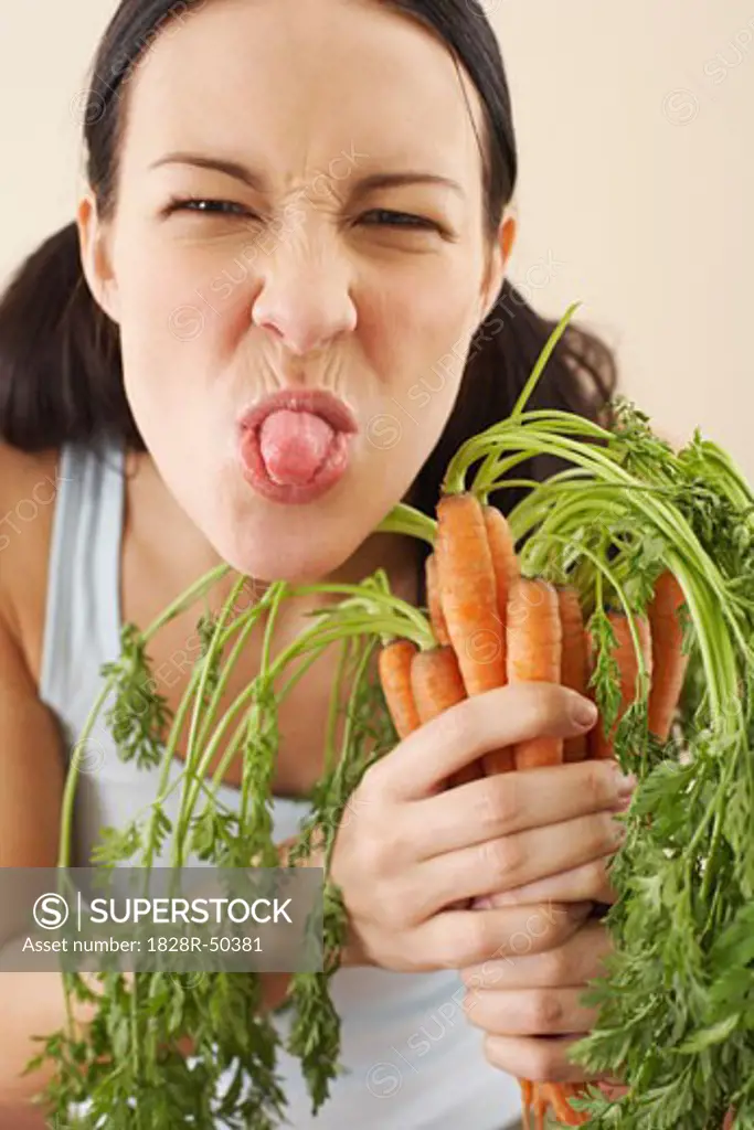 Woman Holding Carrots   